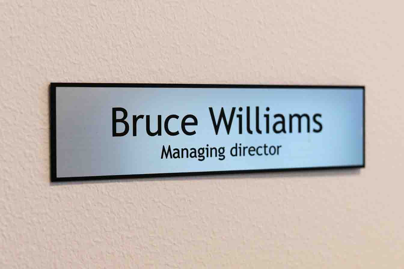 Plastic silver name sign for office