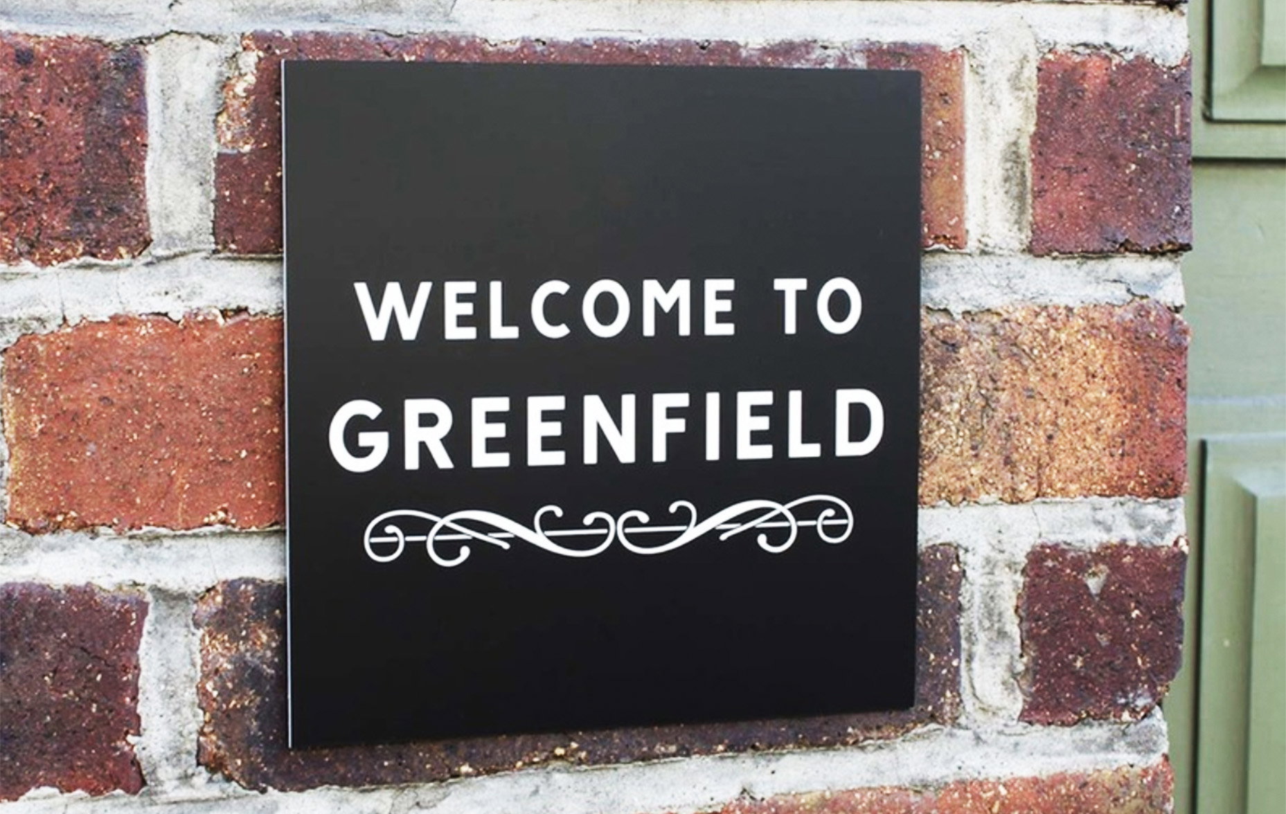 Personalised house sign with white text