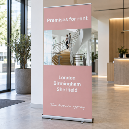 Pink pull-up banner advertising premises for rent in a bright office lobby