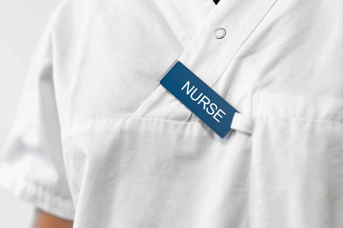 Staff name badge with name and title